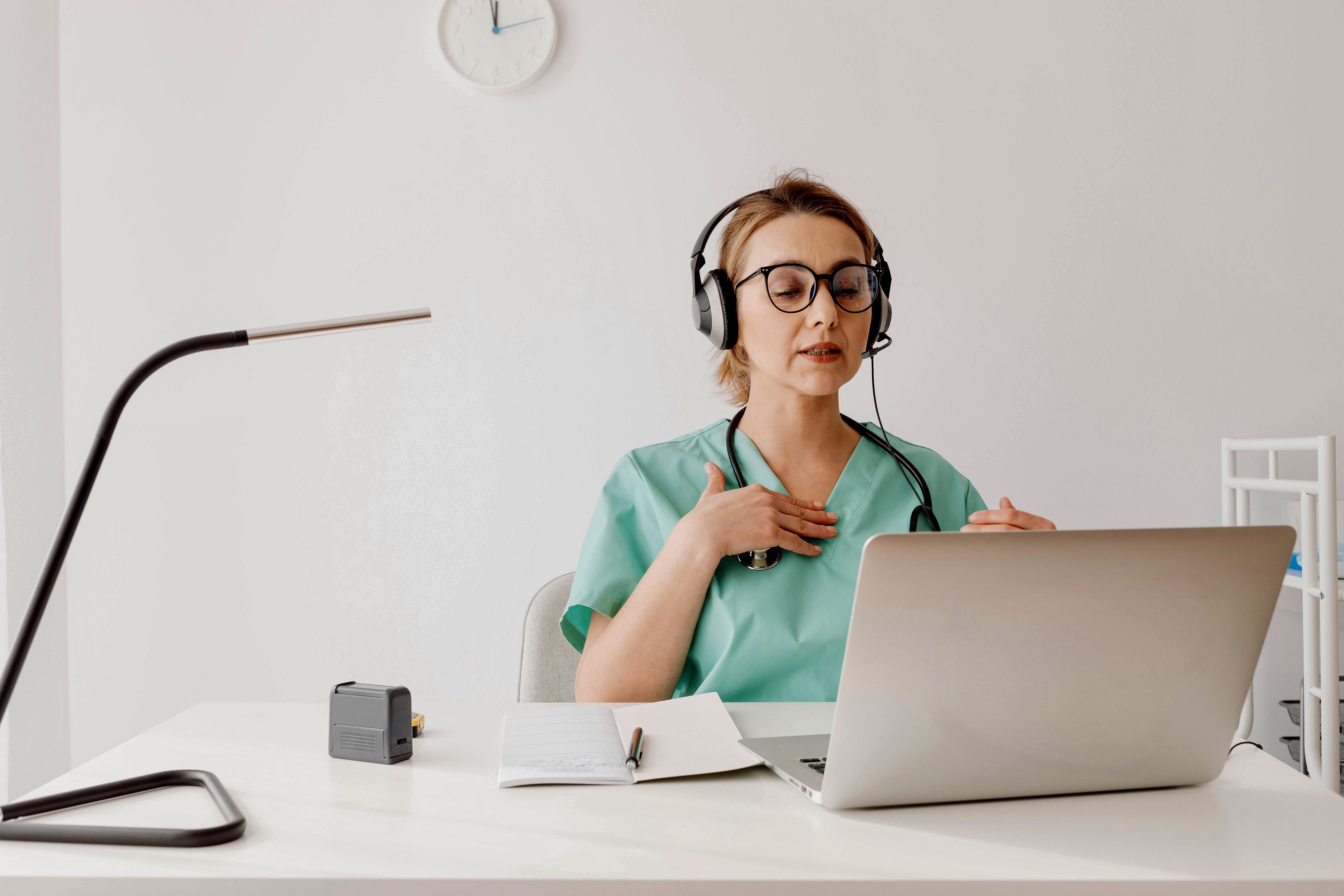 A doctor in front of her computer